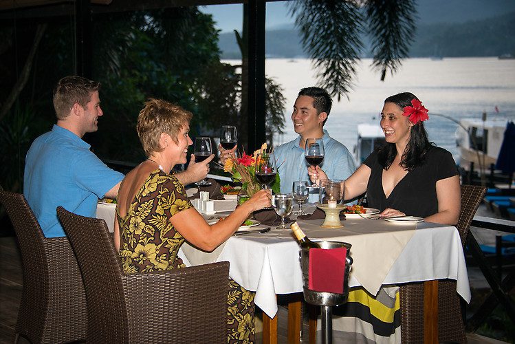 Diners have the option to sit at individual tables or at the communal table with fellow divers and resort management